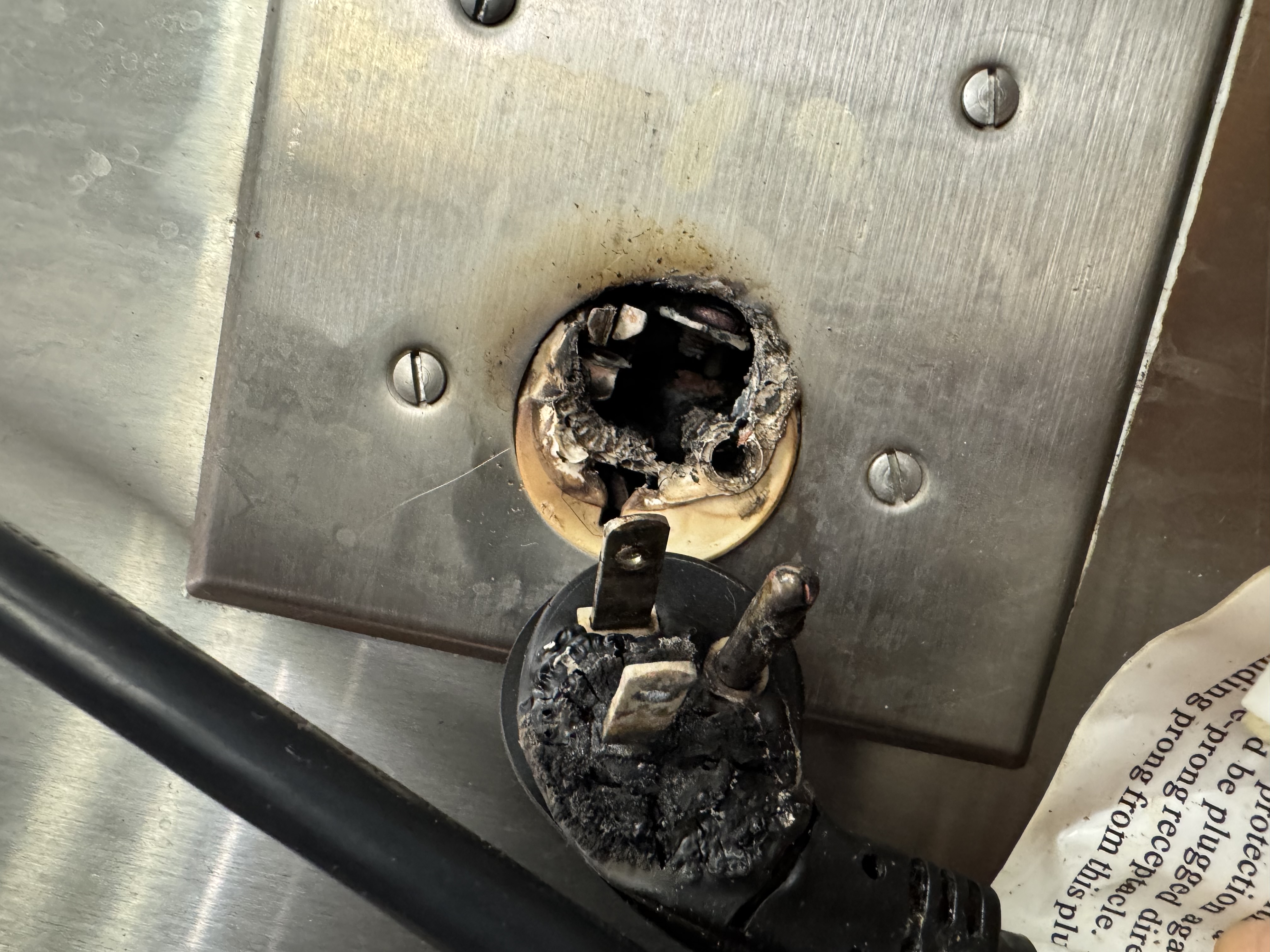 Burned electrical outlet requiring residential troubleshooting in Reno, Nevada